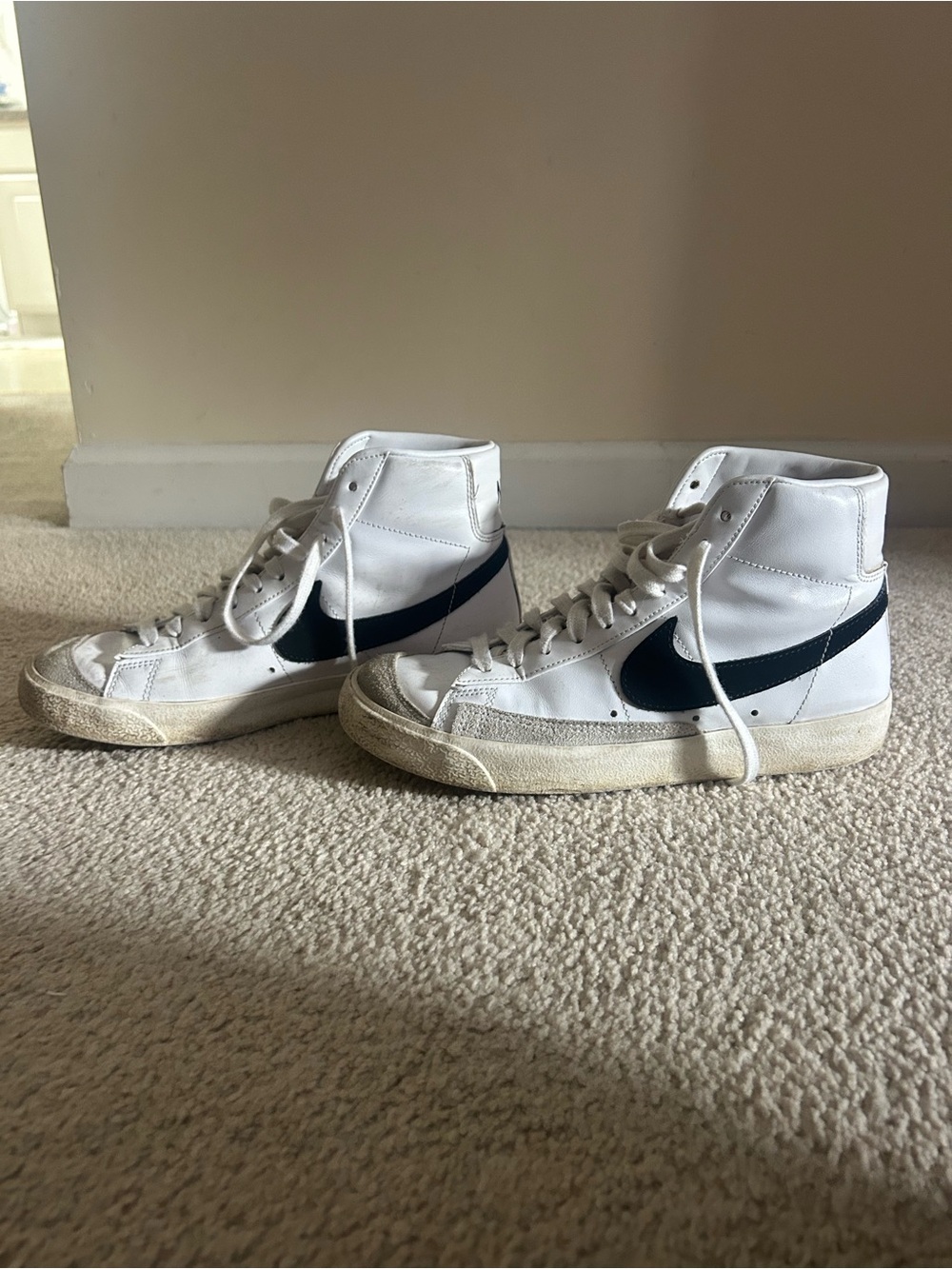 Nike White High-Top Sneakers with Black Swoosh